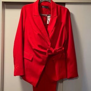 Brand new with tags complete blazer and pants. Put on for pict and never worn.